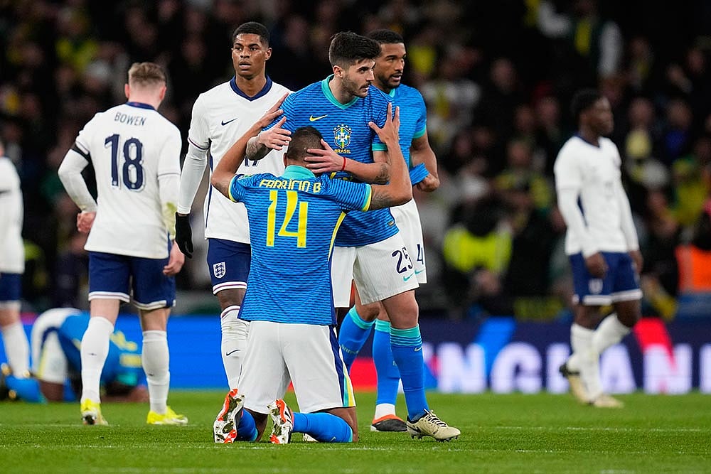 Photo: AP/Kirsty Wigglesworth : England Brazil Soccer