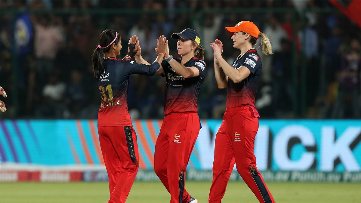 Photo: X/ @wplt20 : Shreyanka Patil (L) celebrating a wicket with her teammates in the Eliminator of WPL 2024.