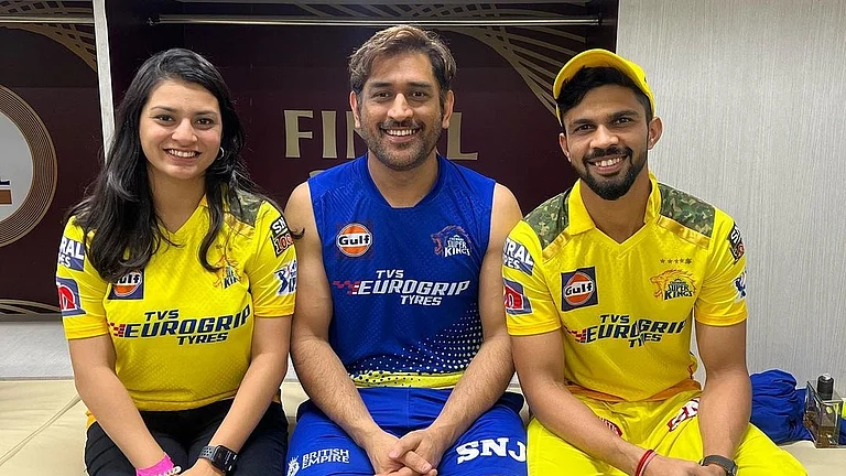 Ruturaj Gaikwad (right) pictured here with MS Dhoni (c) and Utkarsha Gaikwad. - Instagram/ruutu.131