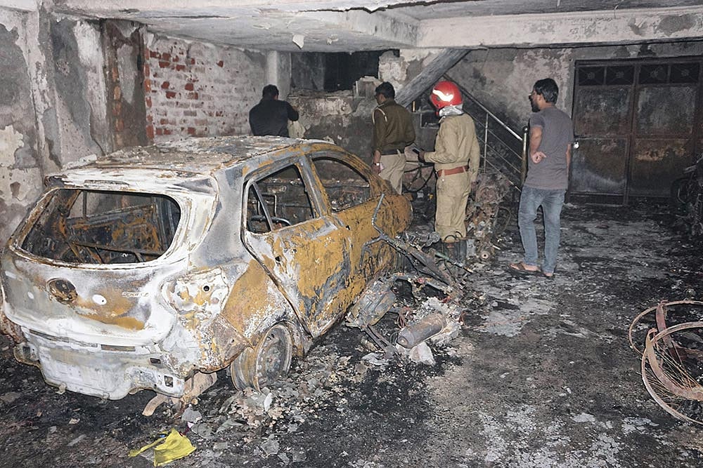 PTI : Rescue team members at a residential building where a fire broke out that killed 4 people, including 2 children, in Delhi's Shastri Nagar.
