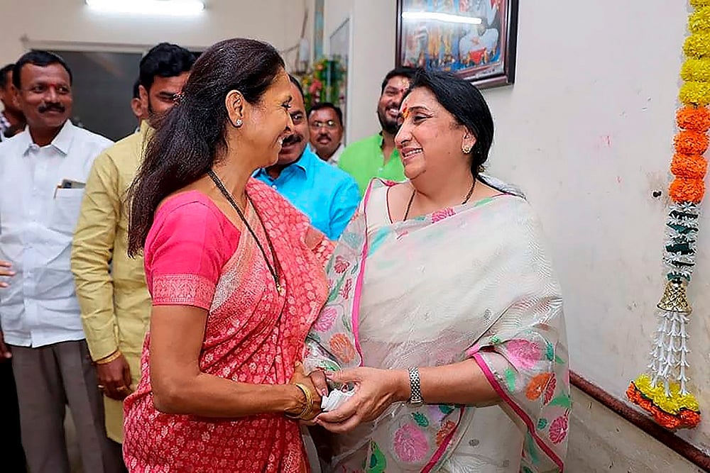 Supriya Sule, Sunetra Pawar meet - | Photo: PTI