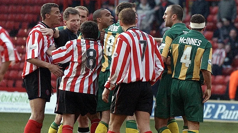 Referee Eddie Wolstenholme was caught in the middle of a melee between Sheffield United and West Brom players at the ‘Battle of Bramall Lane’. - PA