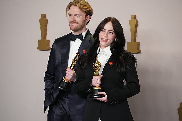 Getty Images : Finneas O'Connell and Billie Eilish, winners of the Best Original Song award at Oscars 2024 pose with the red pin calling for a ceasefire in the Gaza Strip amid Israel's ongoing war on the Palestinians. 
