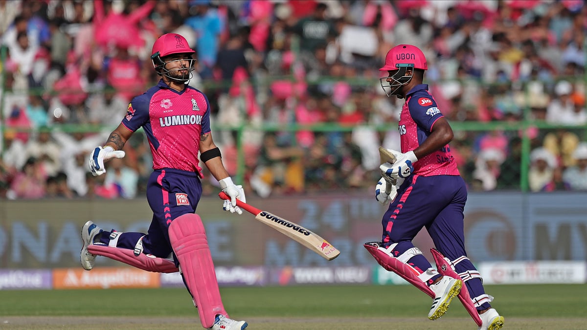 AP Photo/Pankaj Nangia : Rajasthan Royals' captain Sanju Samson, right, and Riyan Parag run between the wickets to score during the Indian Premier League cricket match between Rajasthan Royals and Lucknow Super Giants in Jaipur.