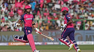 AP Photo/Pankaj Nangia : Rajasthan Royals' captain Sanju Samson, right, and Riyan Parag run between the wickets to score during the Indian Premier League cricket match between Rajasthan Royals and Lucknow Super Giants in Jaipur.