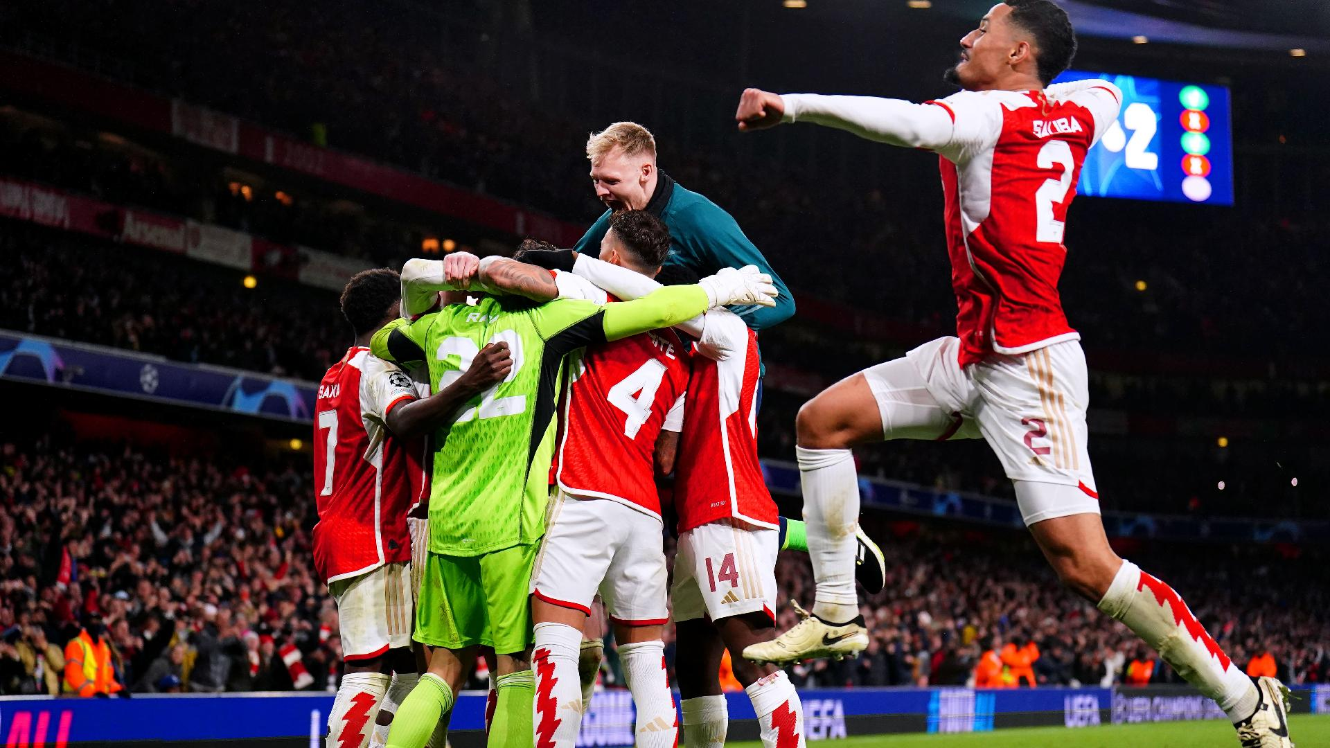 Zac Goodwin, PA : Arsenal players celebrate after winning the penalty shoot-out of the UEFA Champions League Round of 16.