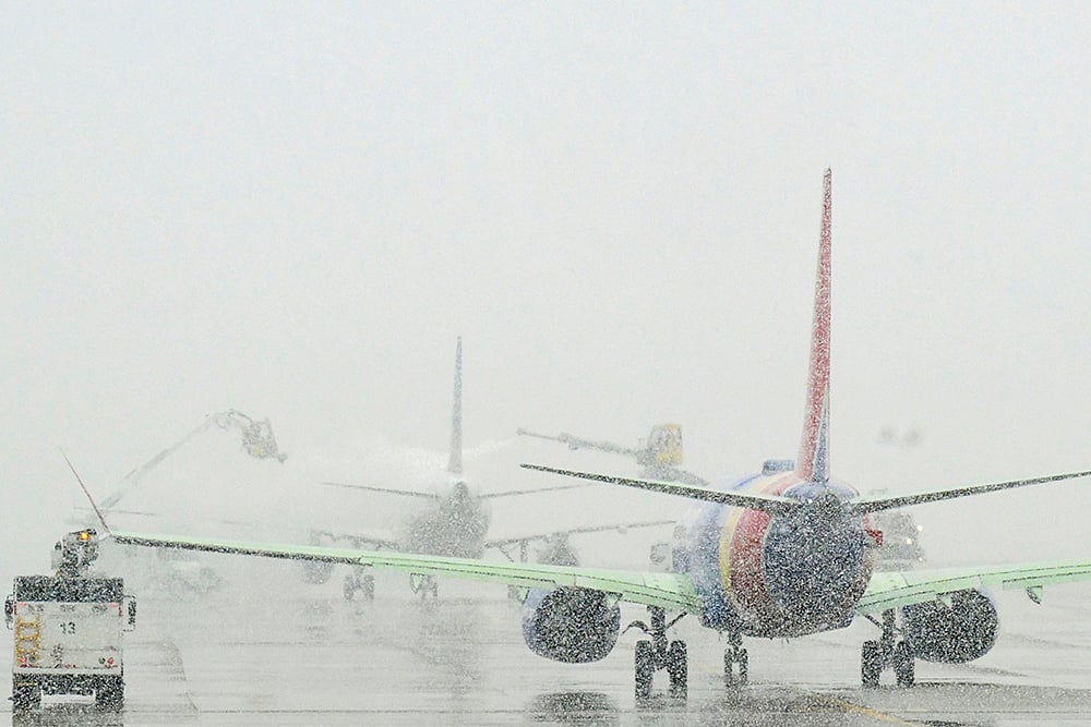 | Photo: RJ Sangosti/The Denver Post via AP : Denver Snowstorm