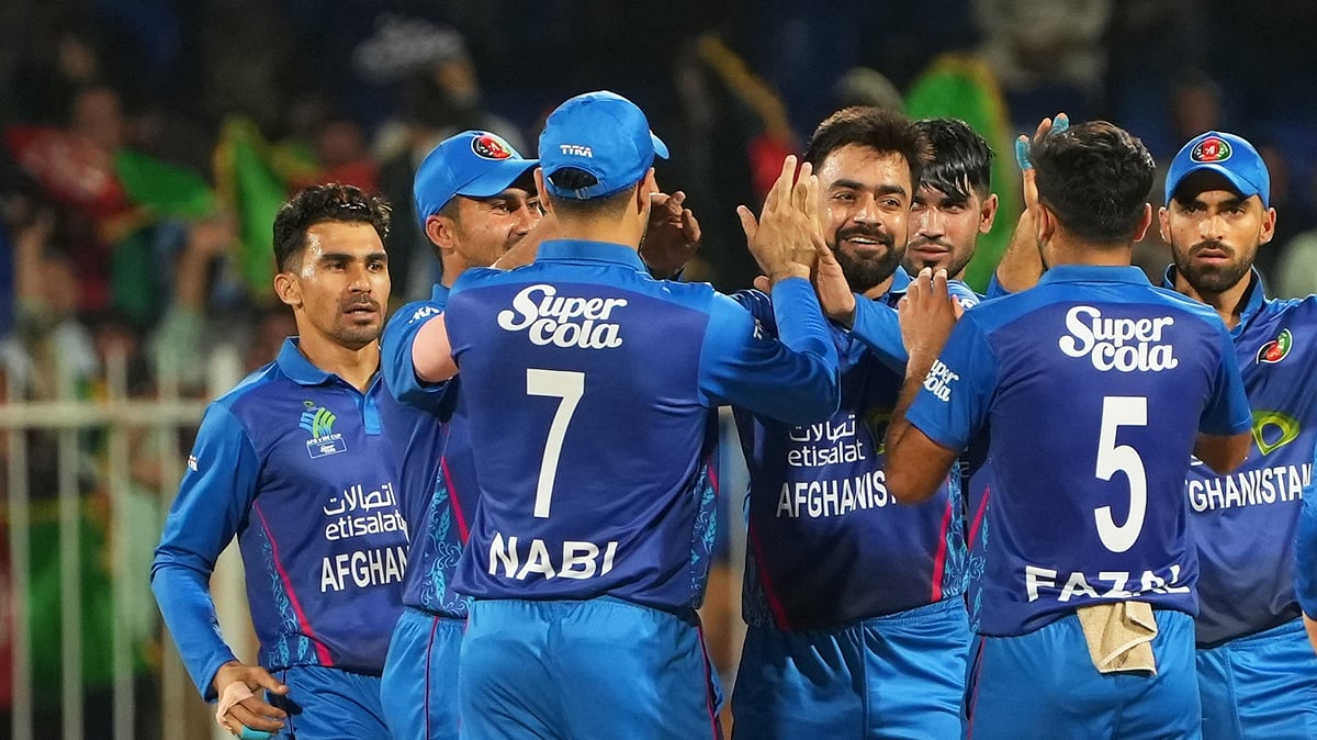 X/Afghanistan Cricket Board : Rashid Khan (centre) celebrates a wicket with teammates during the second Afghanistan vs Ireland T20I match in Sharjah on Sunday (March 17, 2024).