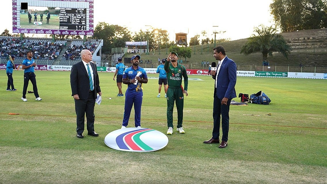 X/Bangladesh Cricket : Captains Najmul Hossain Shanto (second from right) and Charith Asalanka (third from right) at the toss for the second T20I between Bangladesh and Sri Lanka in Sylhet. 