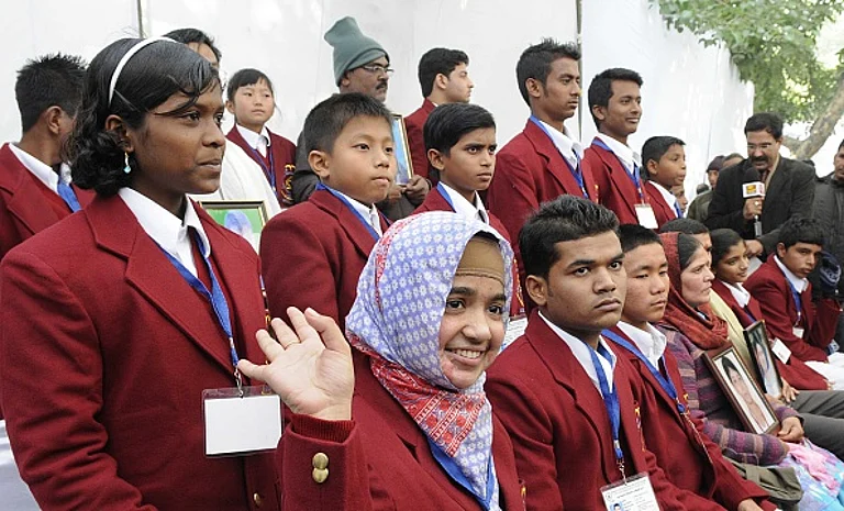 Resham Fatma (white scarf), acid attack victim and National Bravery Bharat Award winner from Uttar Pradesh. - Getty Images