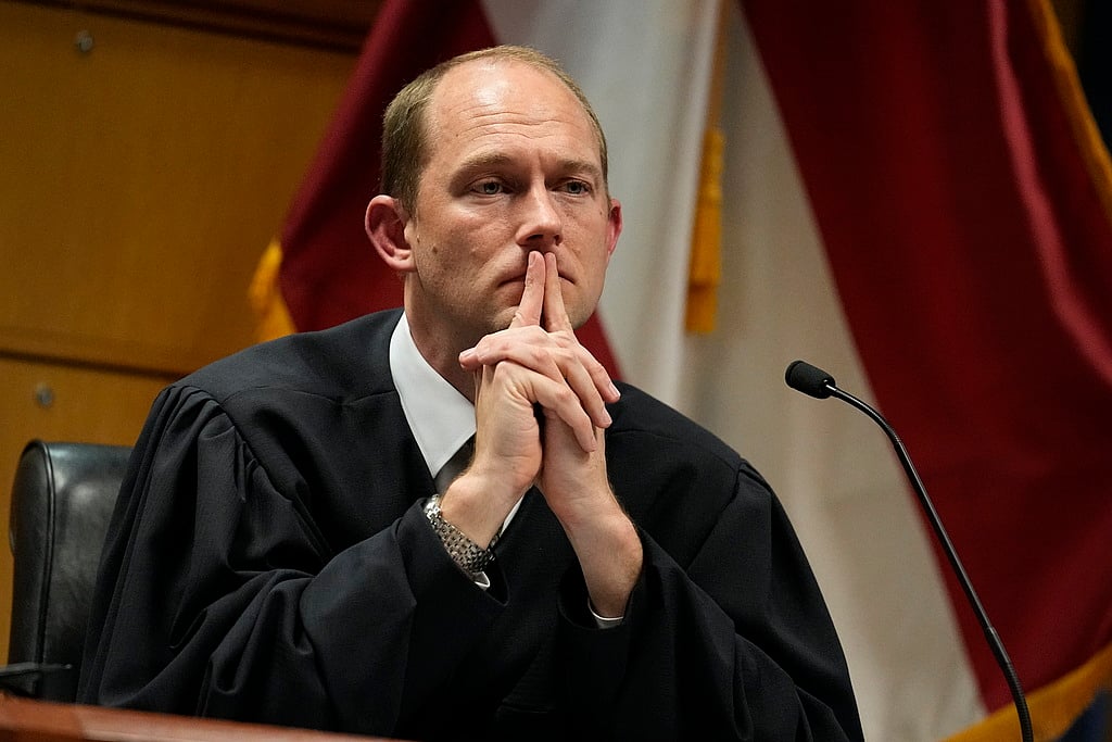 AP : Georgia Judge Dismisses Some Charges Against Trump