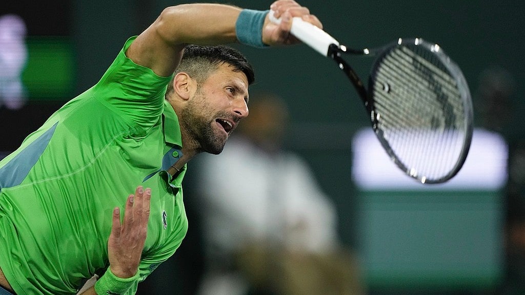 Novak Djokovic, of Serbia, serves to Luca Nardi, of Italy, at the BNP Paribas Open tennis tournament Monday, March 11, 2024, in Indian Wells, Calif. Nardi won 6-4, 3-6, 6-3. 
 - (AP Photo/Mark J. Terrill)
