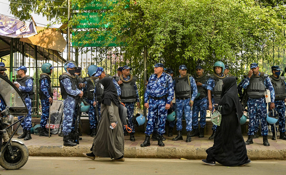 PTI : Security personnel stand guard a day after the Ministry of Home Affairs notified the rules for implementation of the Citizenship (Amendment) Act, at Jamia in New Delhi, Tuesday, March 12, 2024. 