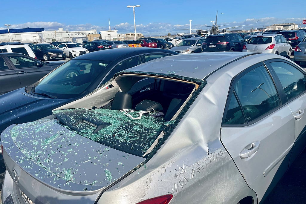 Haven Daley/ AP : Damaged Car After United Airlines Flight Loses Tire
