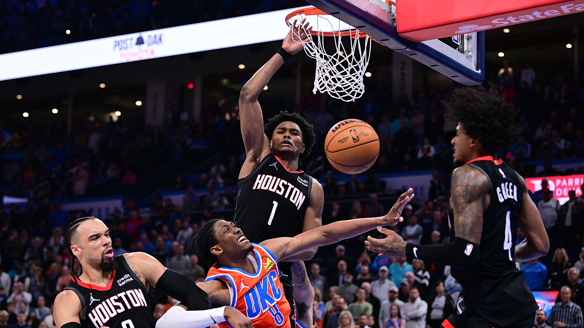 Jalen Williams #8 of the Oklahoma City Thunder puts up a shot against Dillon Brooks #9, Amen Thompson #1 and Jalen Green #4 of the Houston Rockets during the second half at Paycom Center on March 27, 2024.