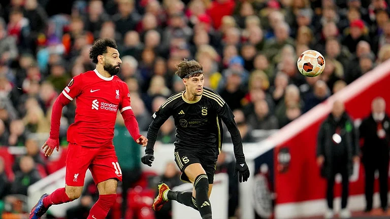 Liverpool's Mohamed Salah vies for the ball with Sparta Prague's Veljko Birmancevic, right, during their UEFA Europa League round of 16, second leg football match at Anfield Stadium on Friday (March 15, 2024). - AP/Jon Super