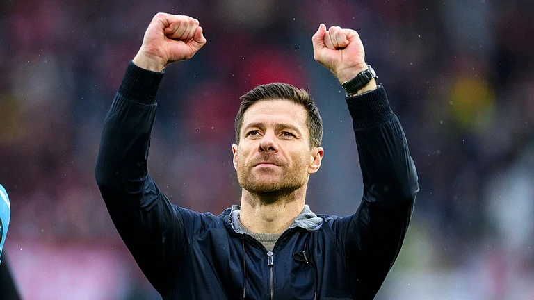 Leverkusen's head coach Xabi Alonso celebrates after the Bundesliga soccer match between Bayer 04 Leverkusen and SC Freiburg at the Europa-Park Stadium in Freiburg, Germany, Sunday, March 17, 2024.
- (Tom Weller/dpa via AP)