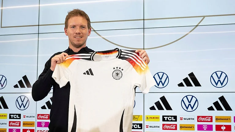 Germany coach Julian Nagelsmann presents the DFB team's new official European Championship jersey ahead of the international friendly matches against France and The Netherlands during a press conference in Frankfurt, Germany on March 14, 2024. - Boris Roessler/dpa via AP