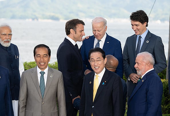 (Photo by Jacques WITT via Getty Images) : India's Prime Minister Narendra Modi, Indonesia's President Joko Widodo, France's President Emmanuel Macron, Japan's Prime Minister Fumio Kishida, US President Joe Biden, Brazil's President Luiz Inacio Lula de Silva and Canada's Prime Minister Justin Trudeau gather for a photo of leaders of the G7 and invited countries during the G7 Leaders' Summit in Hiroshima on May 20, 2023. 