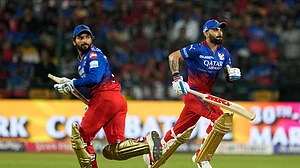 AP Photo/Aijaz Rahi : Royal Challengers Bengaluru's Virat Kohli, right, and Rajat Patidar run between the wickets to score during the Indian Premier League match between Royal Challengers Bengaluru and Punjab Kings in Bengaluru.
