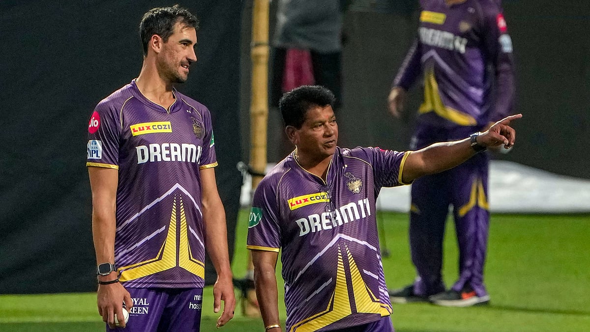 Chandrakant Pandit with Mitchell Starc during a Kolkata Knight Riders practice session. - PTI Photo/Swapan Mahapatra