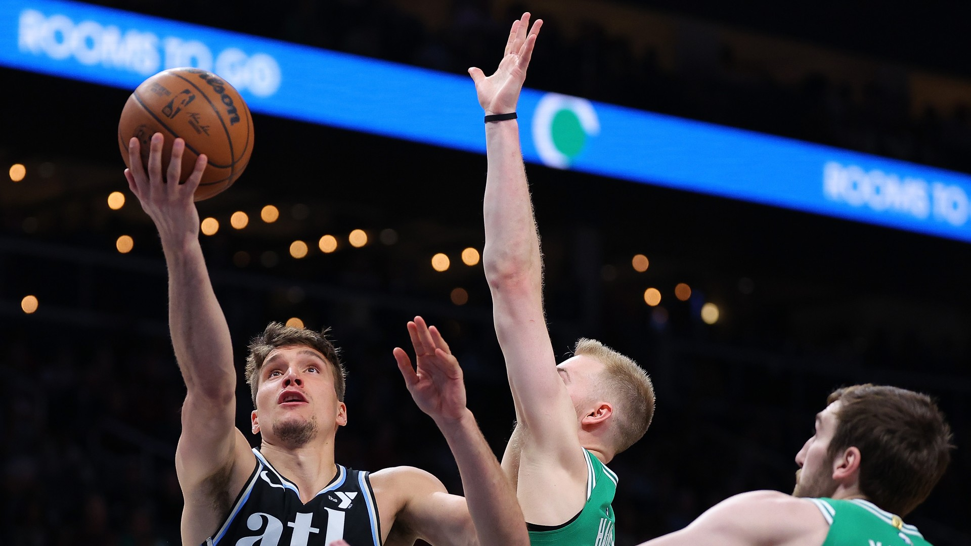 Atlanta Hawks guard Bogdan Bogdanovic attempts a shot vs. the Boston Celtics on March 25, 2024.