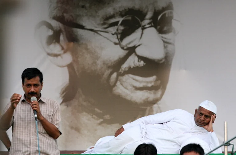 NEW DELHI, INDIA -AUGUST 19: Team Anna memeber Arvind Kejriwal speaks also seen Veteran Indian social activist Anna Hazare at Ramlila Maidan in New Delhi on Friday. - (Photo by K Asif/The India Today Group via Getty Images)