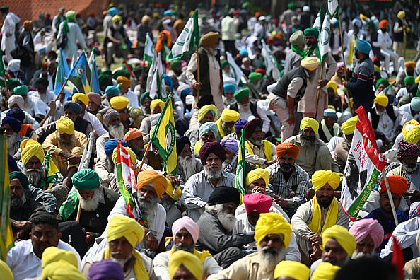 Getty Images : Farmers take part in a sit-in protest  at Ram Lila ground in New Delhi on March 14, 2024