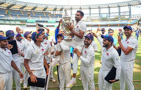 Dhawal Kulkarni lifts the championship trophy after Mumbai beat Vidarbha in the final of Ranji Trophy 2024 at the Wankhede Stadium, in Mumbai on March 14, 2024.