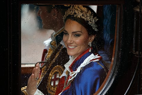 Kate, Princess of Wales and Prince William travel in a coach following the coronation ceremony of Britain's King Charles III in London, Saturday, May 6, 2023. 