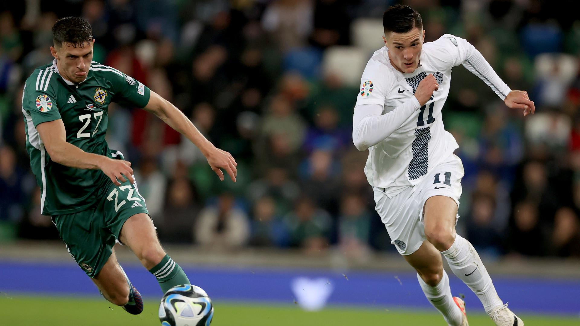  PA : Northern Ireland’s Eoin Toal battles with Slovenia’s Benjamin Sesko, right.
