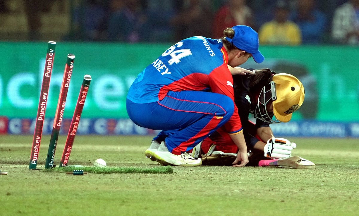 Delhi Capitals player Alice Capsey (left) consoles Royal Challengers Bangalore's Shreyanka Patil after their Women's Premier League 2024 match at the Arun Jaitley Stadium in New Delhi on Sunday (March 10).