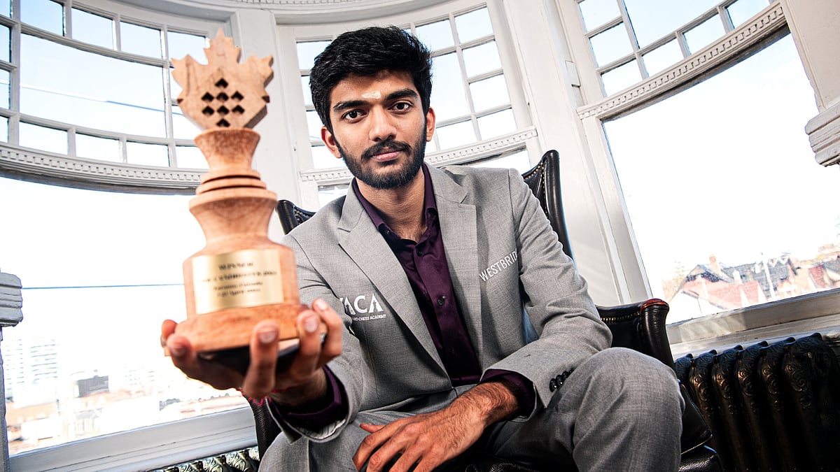 FIDE/Stev Bonhage : Indian Grandmaster D Gukesh poses with the trophy after winning the FIDE Candidates 2024 tournament in Toronto.