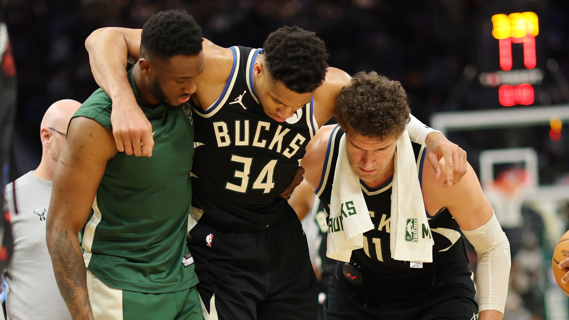 Milwaukee Bucks forward Giannis Antetokounmpo is helped off the court in a game vs. the Boston Celtics on April 9, 2024. - null