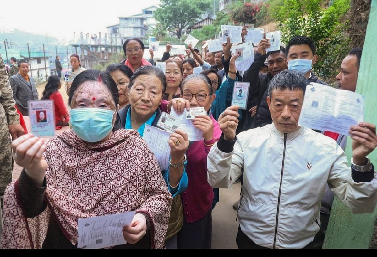 PTI : People show their ID cards as they wait to cast their votes for Lok Sabha elections, in Namchi district, Sikkim, Friday, April 19, 2024.