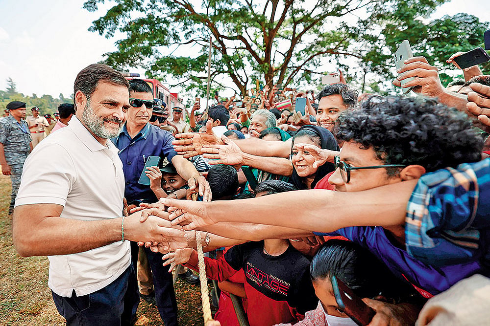 Photo: PTI : Southern Comfort?: Rahul Gandhi with his supporters before filing his nomination on April 3