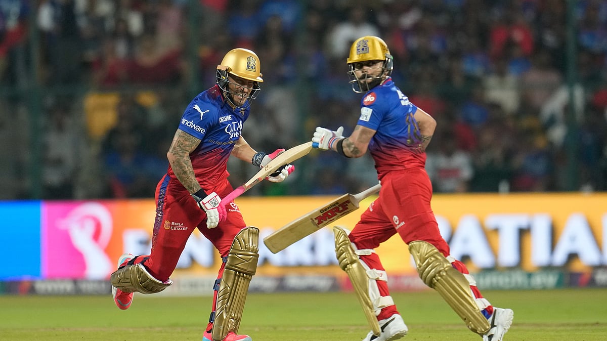 Royal Challengers Bengaluru's captain Faf du Plessis, left, and Virat Kohli run between the wickets to score a boundary during the Indian Premier League 2024 match between Royal Challengers Bengaluru and Kolkata Knight Riders in Bengaluru. - AP Photo/Aijaz Rahi