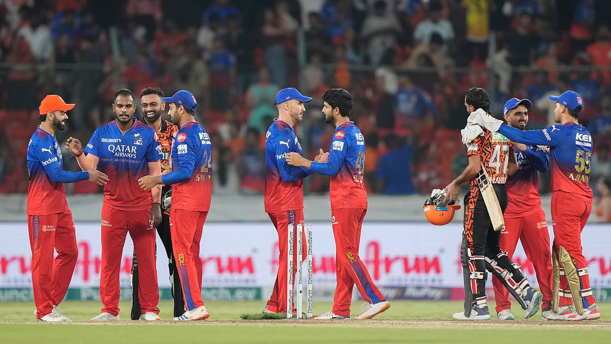 Royal Challengers Bengaluru players celebrate their win against Sunrisers Hyderabad during the Indian Premier League in Hyderabad. - AP Photo/Mahesh Kumar A.