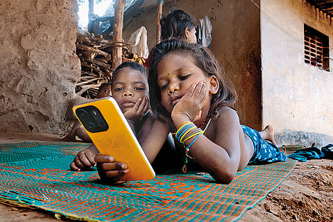 Stark Contrast: Children in Ratwad village watching YouTube reels  