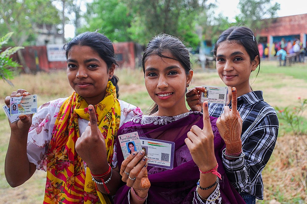 Photo: PTI : Repolling underway at the Parthampura booth, Gujarat