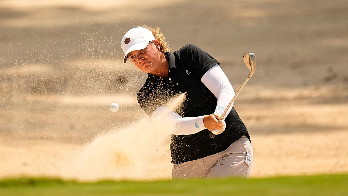 Eric Gay/AP : Lauren Coughlin hit from the bunker on the eighth green during the first round at the Chevron Championship.