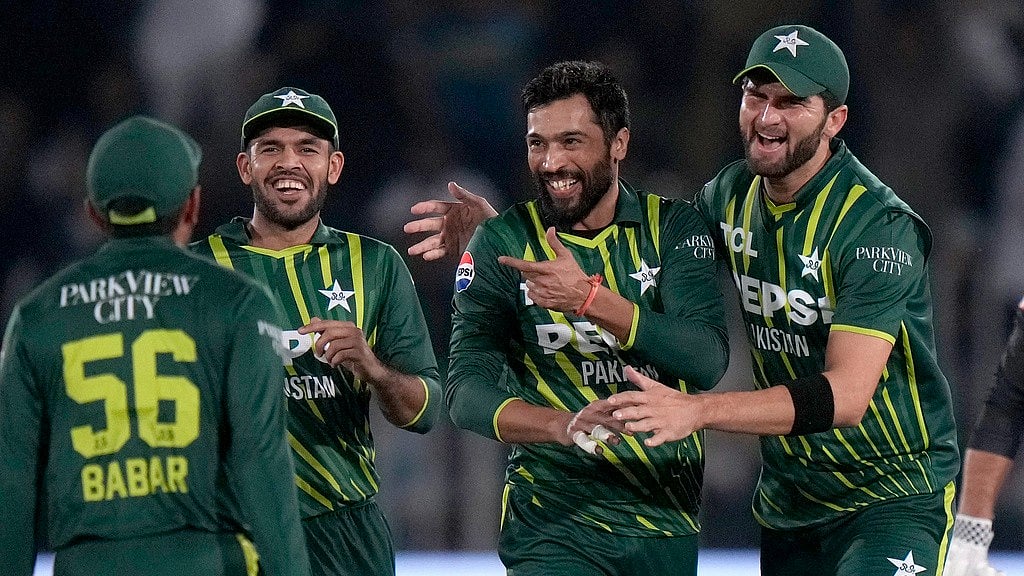 Pakistan's Mohammad Amir, second right, celebrates with teammates after taking the wicket of New Zealand's Tim Robinson during the second T20I in Rawalpindi on April 20, 2024. - AP