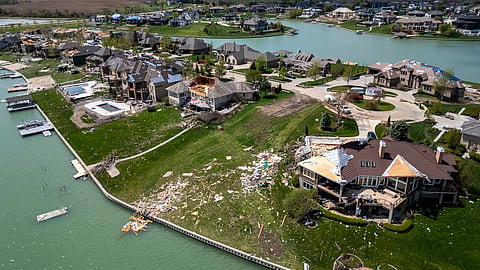 Damaged homes are seen after a tornado hit the Newport Landing neighborhood in Bennington, Neb., Saturday, April 27, 2024. Dozens of reported tornadoes wreaked havoc Friday in the Midwest. 