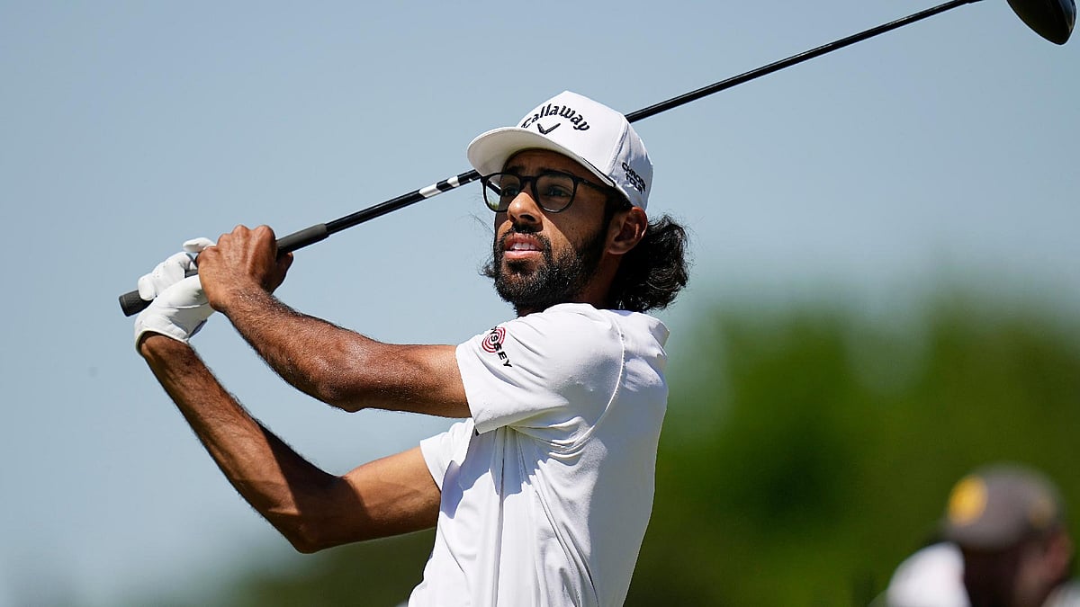 Akshay Bhatia watches his tee shot on the fourth hole during the first round of the Texas Open golf tournament.  - Eric Gay/AP