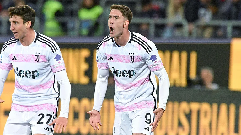 Dusan Vlahovic celebrates scoring for Juventus in their 2-2 draw at Cagliari. - Gianluca Zuddas/LaPresse via AP/PA