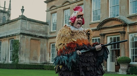 Daniel Ings, sporting a hand-feathered chicken costume