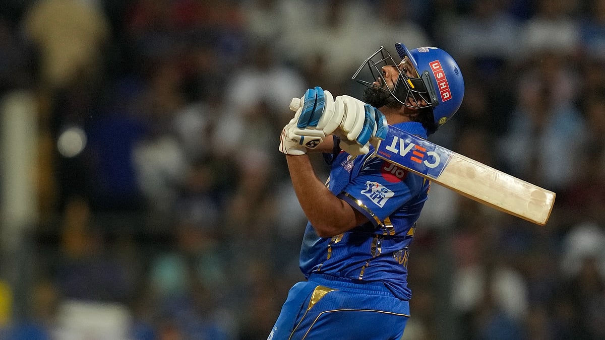 (AP Photo/Rajanish Kakade) : Mumbai Indians' Rohit Sharma plays a shot during the Indian Premier League cricket match between Mumbai Indians and Royal Challengers Bengaluru, in Mumbai, India, Thursday, April 11, 2024. 