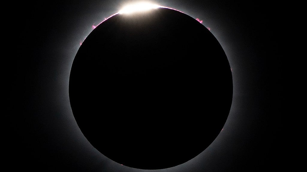 The moon nearly covers the sun during a total solar eclipse, as seen from Bishop's University in Sherbrooke, Quebec. - AP