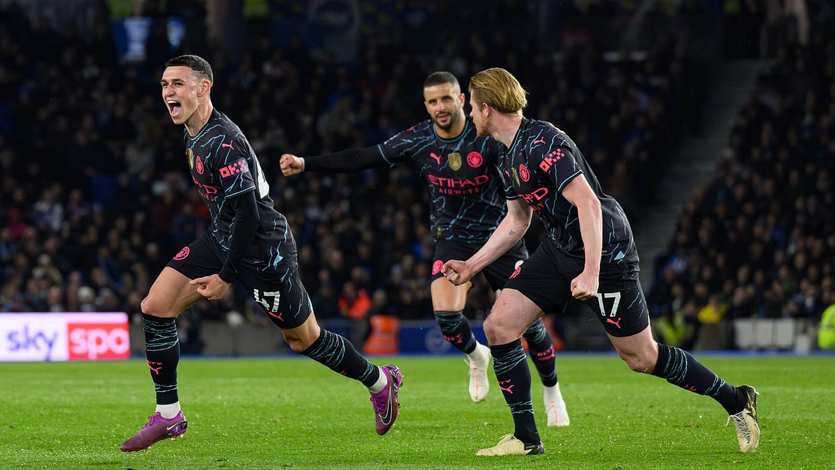 Phil Foden leads the celebrations.