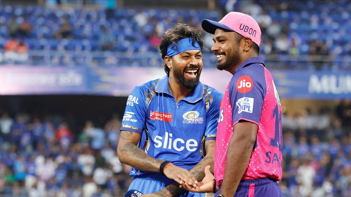 Photo: X/ @IPL : Mumbai Indians captain Hardik Pandya (L) with Rajasthan Royals skipper Sanju Samson at toss time in IPL 2024.